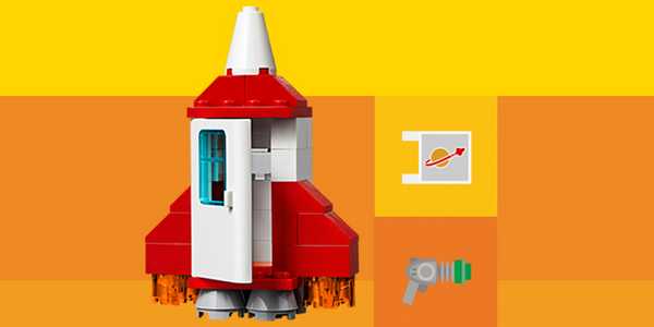 A LEGO® rocket build against yellow background.